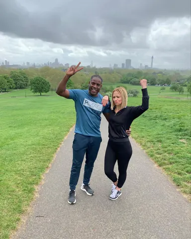 Peter Mac with Kimberley Walsh on Primrose Hill, with the London skyline behind