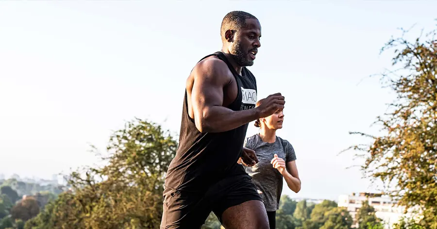 Peter coaching a client on an outdoor run